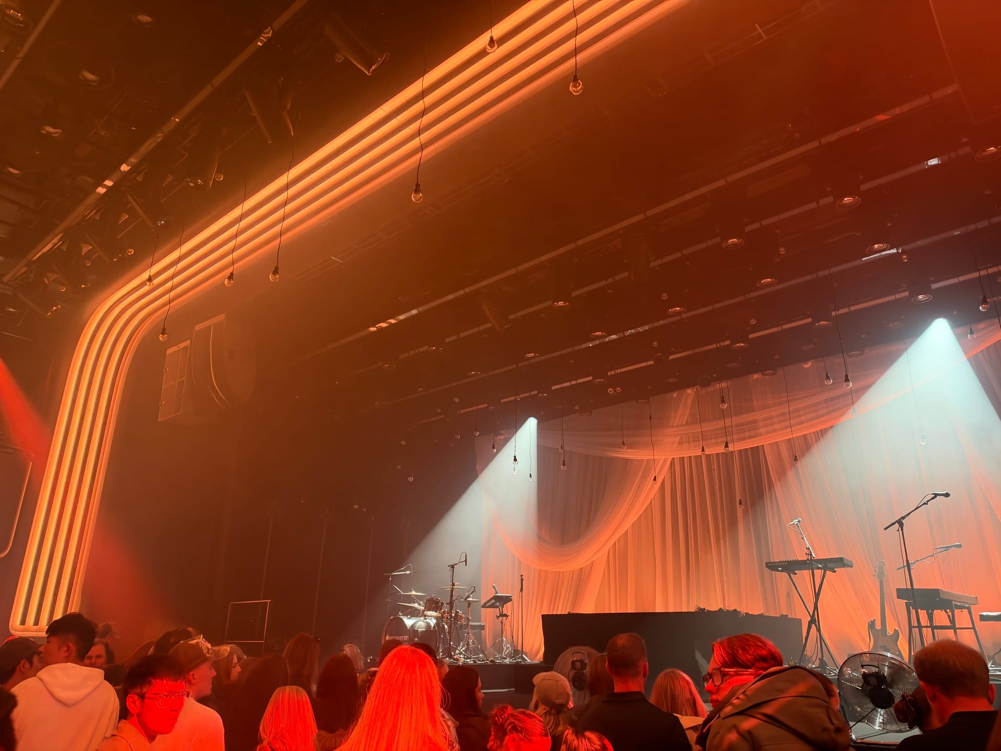 The empty stage before the show started, with bright orange lights.